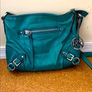 Barely used Michael Kohrs Side turquoise purse